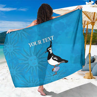 Blue beach sarong fully spread, bird graphic and 'YOUR TEXT' centered