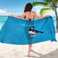 Blue beach sarong with bold bird graphic and 'YOUR TEXT' print