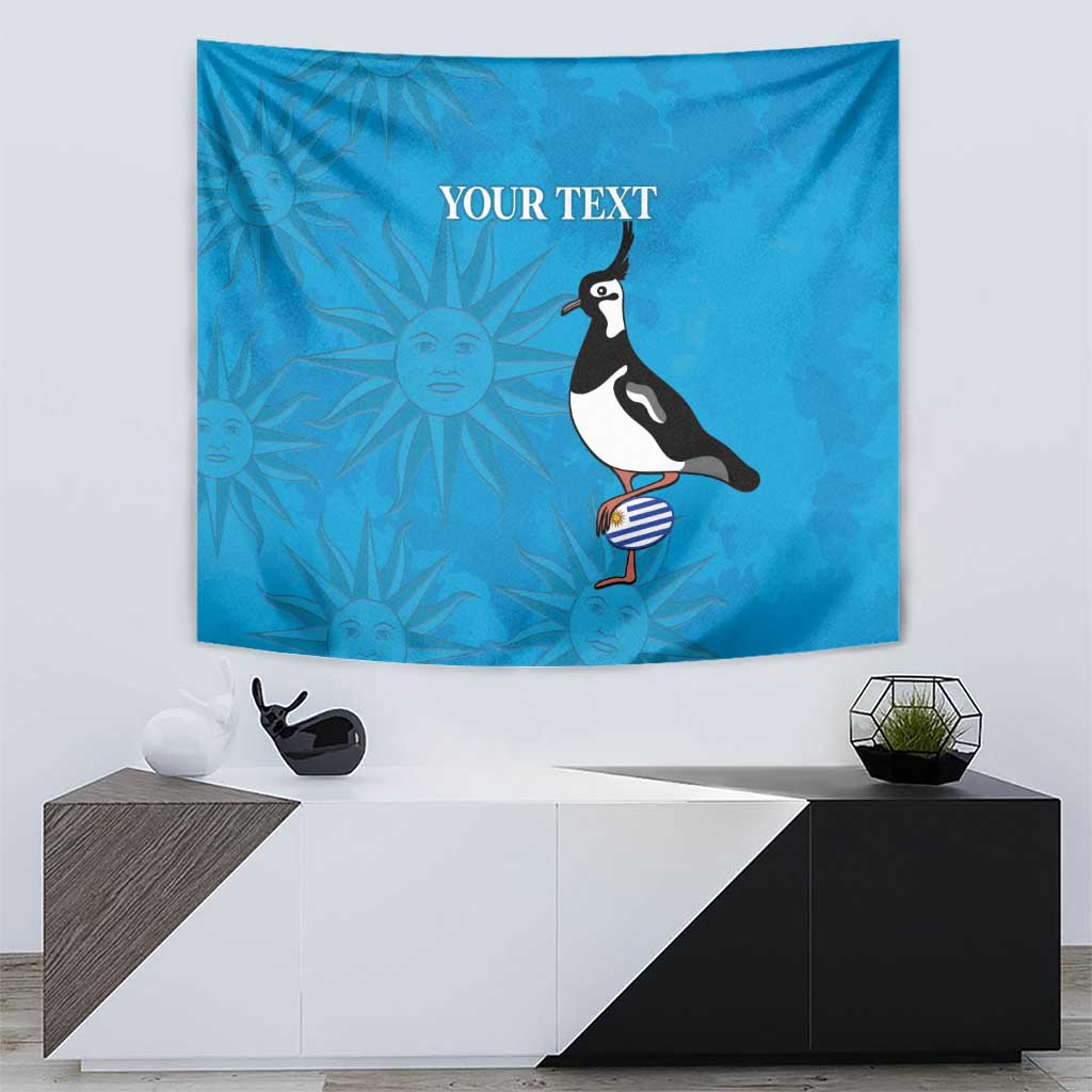 Blue tapestry featuring penguin with striped ball and sunburst pattern