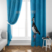Blue window curtain pair with bird print and 'YOUR TEXT' across fabric