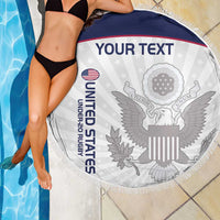 150cm round beach blanket, white with navy border and eagle emblem, fringed edge