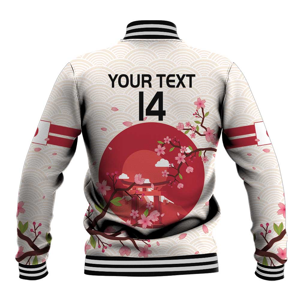 White rugby jacket back with large red cherry blossom circle, black ribbed hem and cuffs