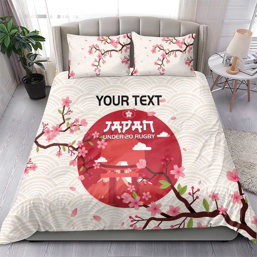 White duvet cover and pillowcases with pink blossom branches and red under-20 rugby print