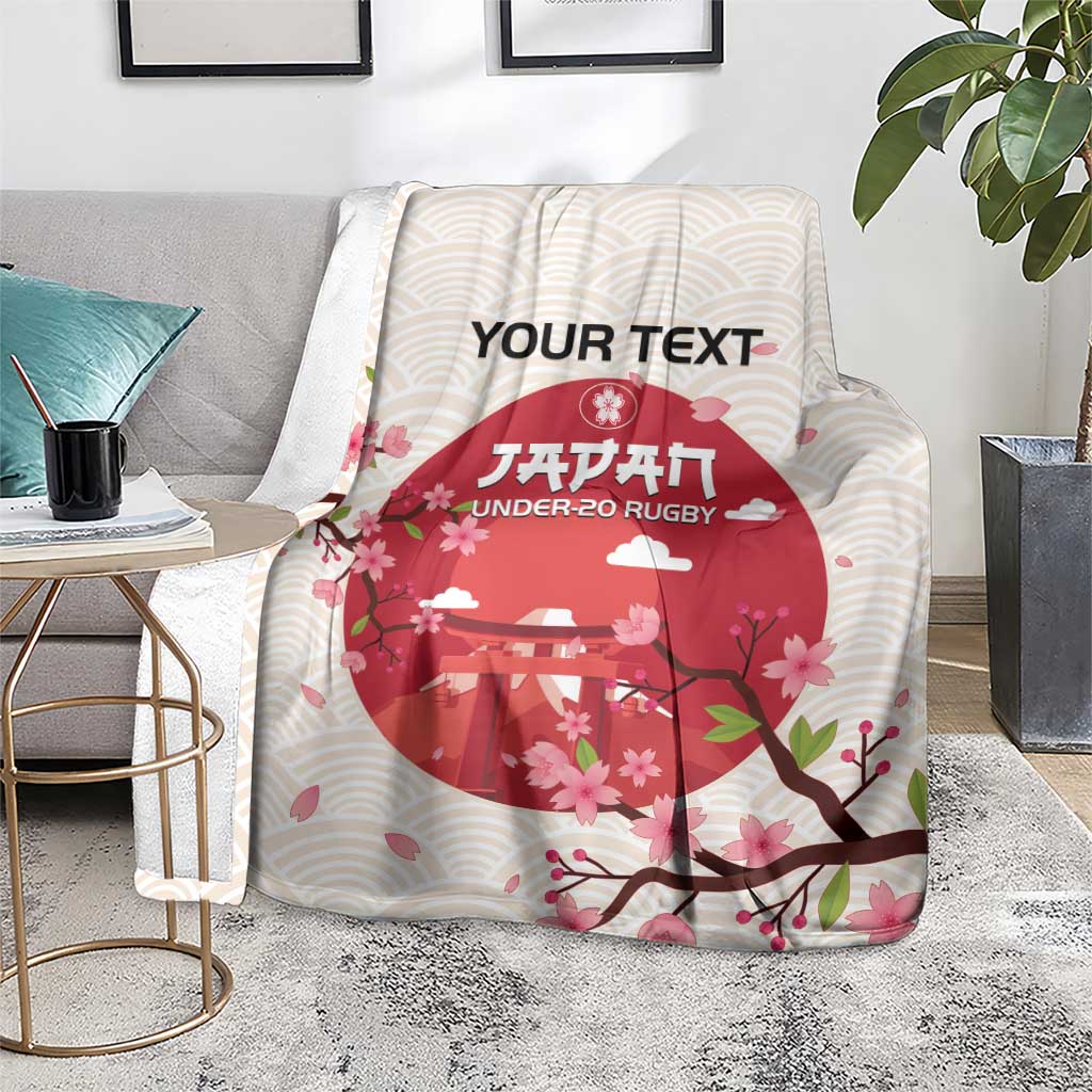 Personalized rugby blanket on floor, white wavy stripes and red cherry blossom scene