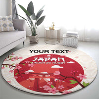 Round cherry blossom rug with cream striped edge, red torii scene, and 'UNDER-20 RUGBY' logo