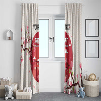Long cream striped window curtains with cherry blossom branches and red rugby panel.