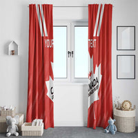 Red Canada maple leaf curtain panels with custom text, hanging over a doorway window