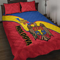 Red, blue, and yellow quilt bed set with two red pillows and Moldova emblem graphic