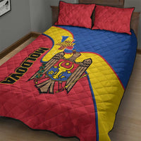 Red, blue, and yellow quilt bed set with two red pillows featuring Moldova emblem and August 27
