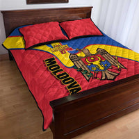Quilt bed set with Moldova text, August 27 date, red-blue-yellow quilt, and two red pillows