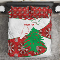 Personalised bedding set with red patterned pillows and white duvet featuring Lebanon map and tree