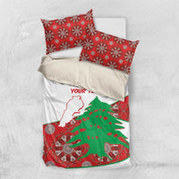 Personalised bedding set flat lay: white duvet with Lebanon outline, cedar tree, and red patterned details