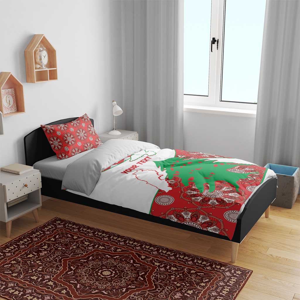 Personalised bedding set on bed: white duvet with Lebanon map and green cedar graphic, red pillowcases