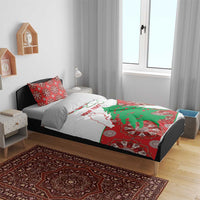 Personalised bedding set on bed: white duvet with Lebanon map and green cedar graphic, red pillowcases