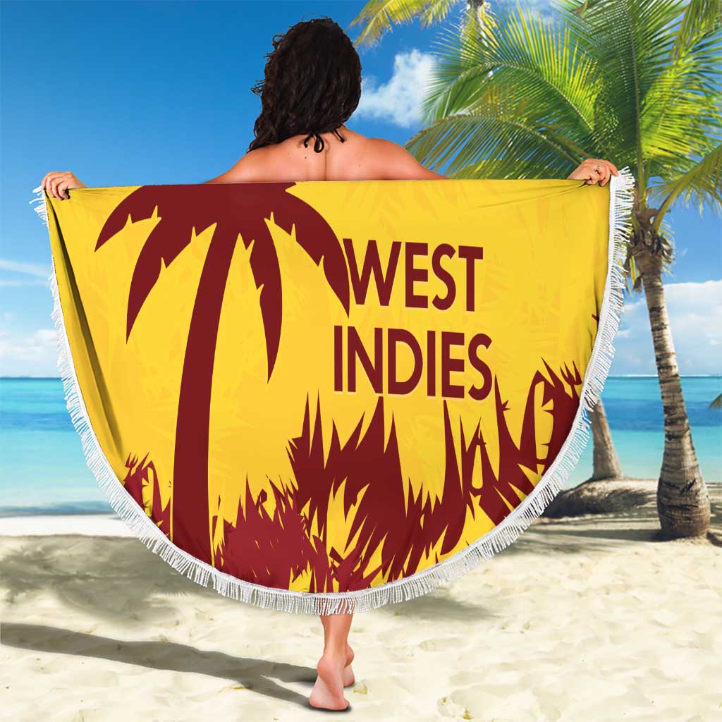 Gold round beach blanket with white fringe, West Indies palm design held on beach