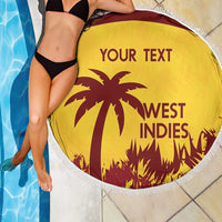 Gold round beach blanket with white fringe, West Indies graphic beside pool