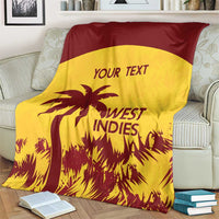 West Indies cricket blanket on couch, gold and maroon with palm tree and 'YOUR TEXT'