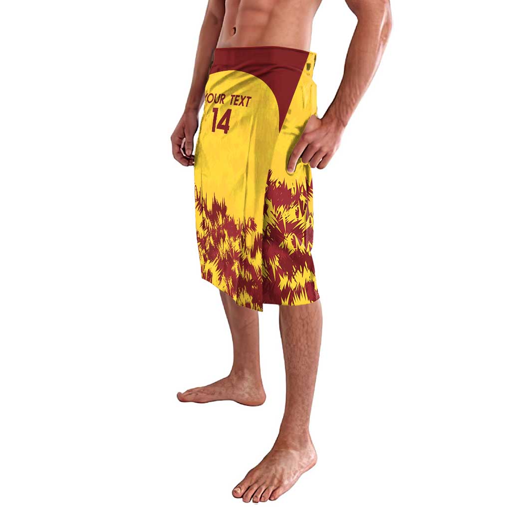 Gold cricket shorts with maroon flame print, maroon waistband, and text 14