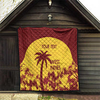 Maroon and yellow quilt hanging under roof, palm tree emblem with “WEST INDIES”