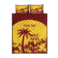 Yellow quilt and maroon border bed set with two pillows, palm graphic and West Indies logo