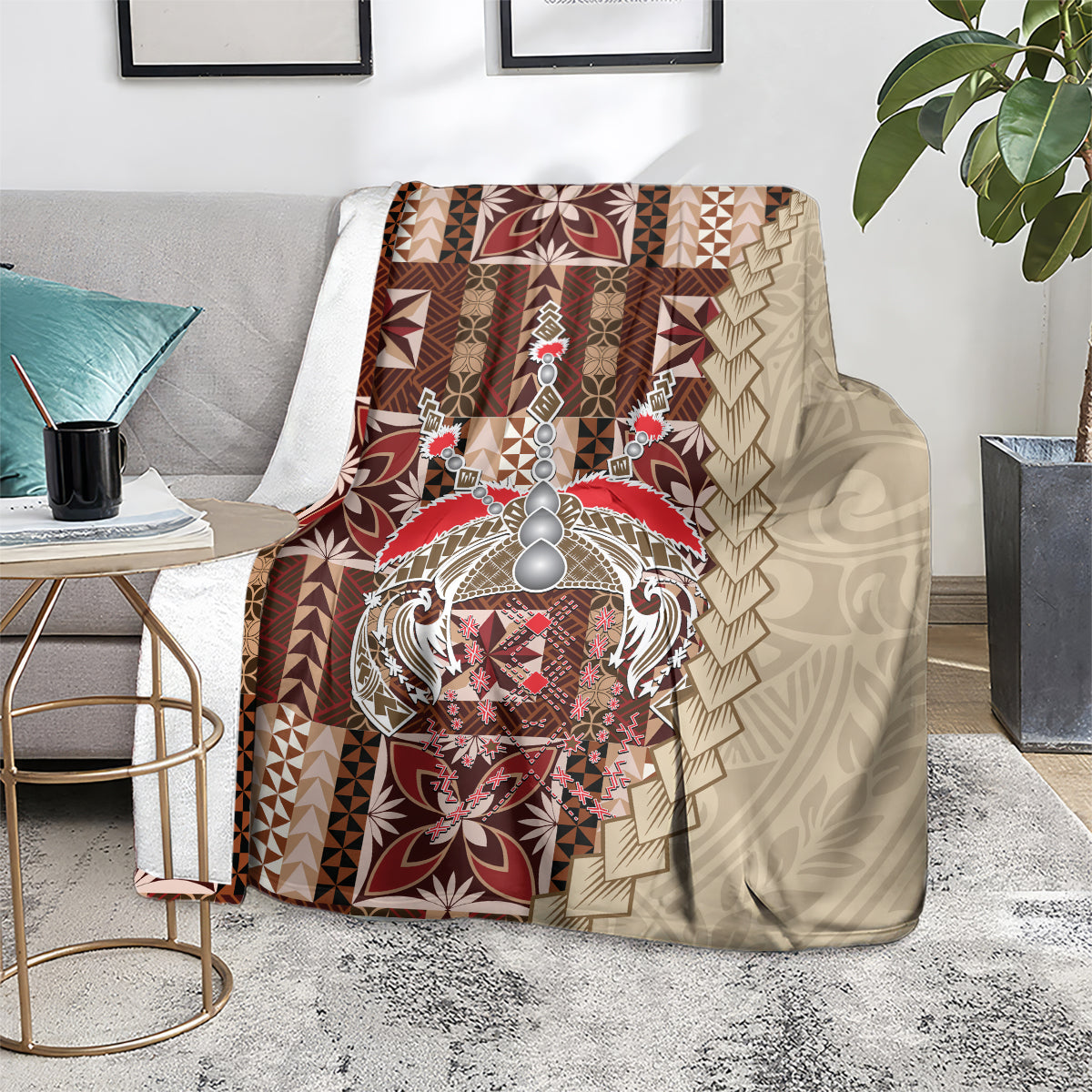 Samoan tapau siapo-pattern blanket on floor, brown/tan geometric panels with burgundy emblem