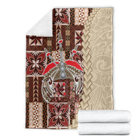 Samoan tapau siapo-pattern blanket folded, brown and tan backing with burgundy central motif