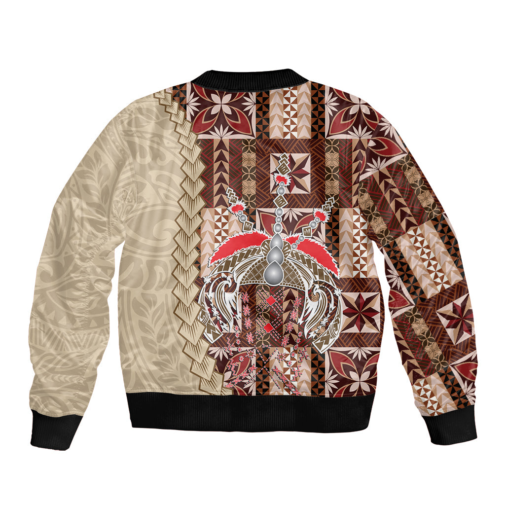 Bomber jacket with cream-and-brown geometric print, large central crest, black ribbed cuffs and hem
