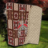 Quilt with brown and red geometric patchwork left side and solid cream diamond quilting right.