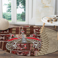 Round siapo-pattern carpet with red and brown centerpiece and beige leaf-like chevron border