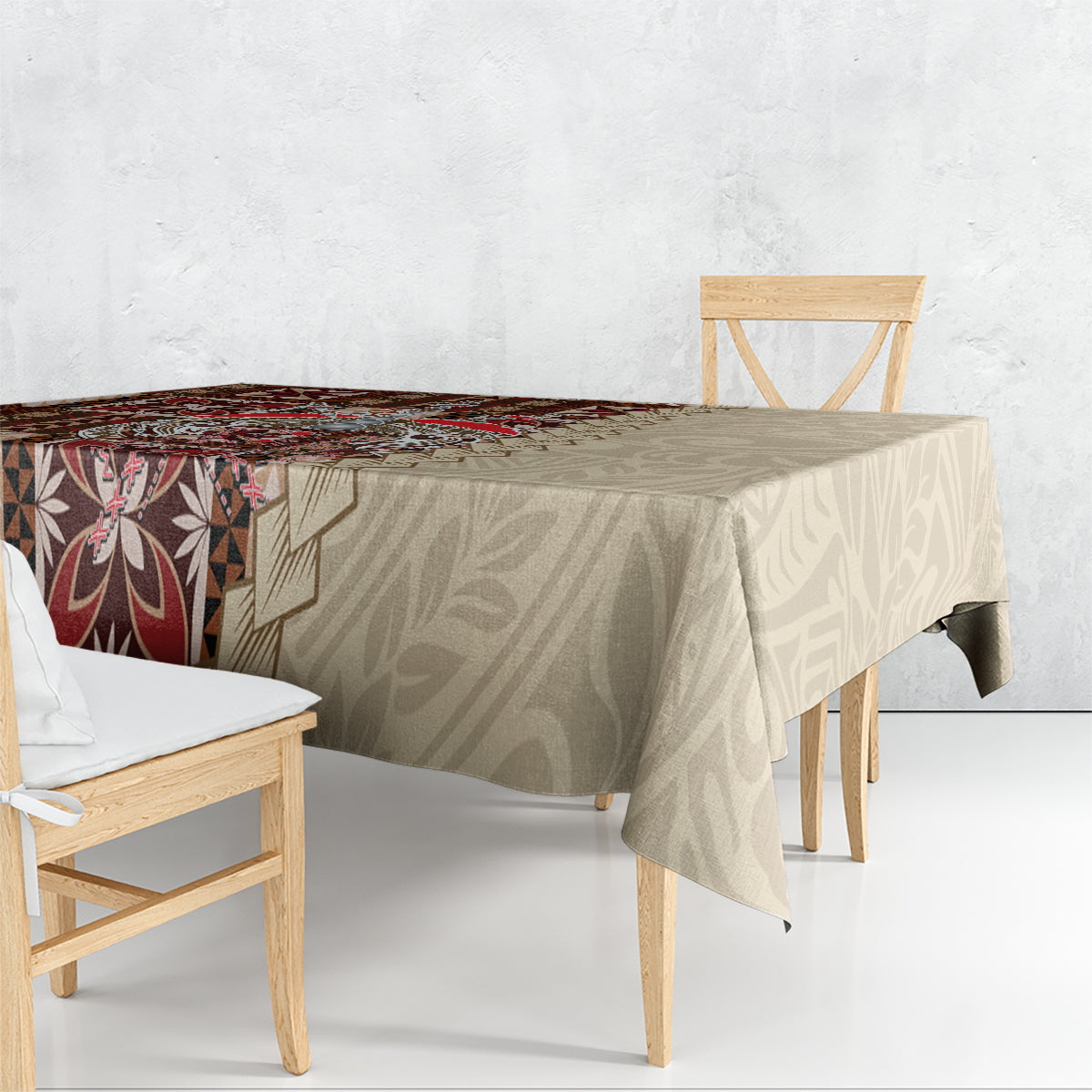 Brown siapo-pattern tablecloth draped over table, featuring geometric squares and leaf-like shapes