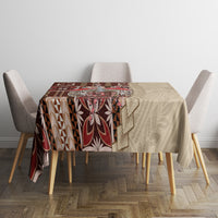 Square brown siapo-pattern tablecloth on dining table, with stylized shapes and border detail