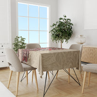 Brown siapo-pattern tablecloth on dining table, showing geometric and floral motifs in red and cream