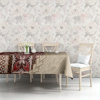 Brown siapo-pattern tablecloth on dining table, with repeating geometric and leaf-like motifs