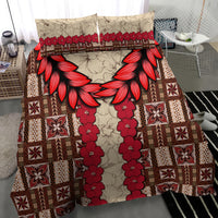 Brown bedding set with red floral garland panel and tapa geometric blocks; two pillowcases