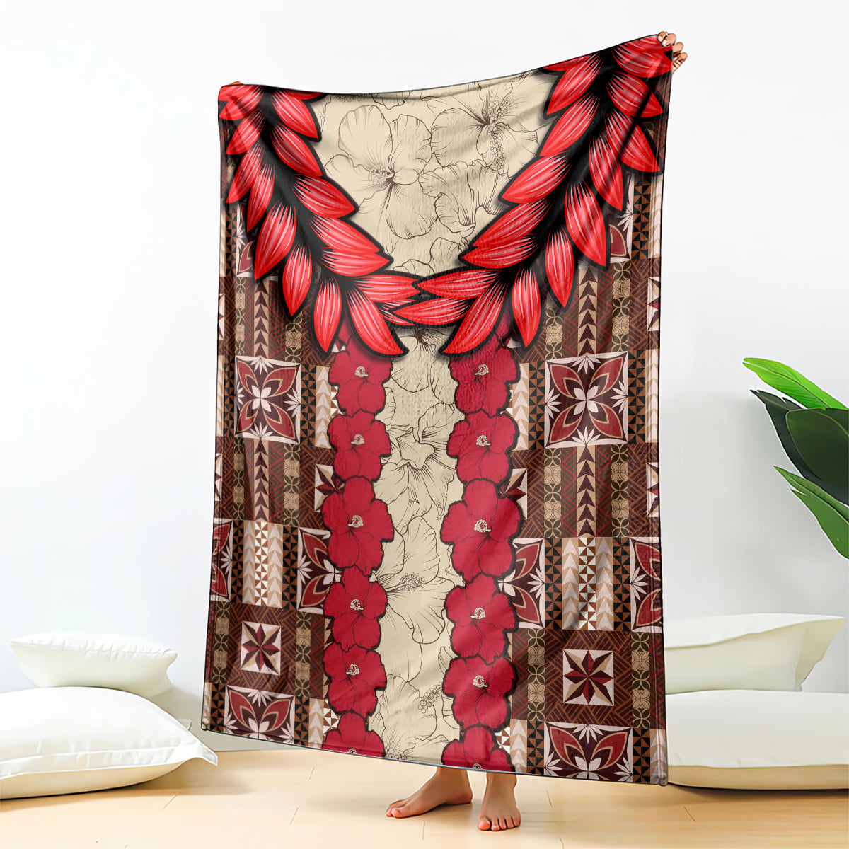Samoa siapo blanket with red hibiscus floral center, brown geometric border, folded over couch arm