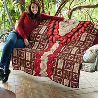 Brown quilt laid out with red leaf wreath, red floral stripe, and cream geometric patchwork