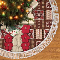 Brown tapa tree skirt with red hibiscus, geometric blocks, and white braided fringe