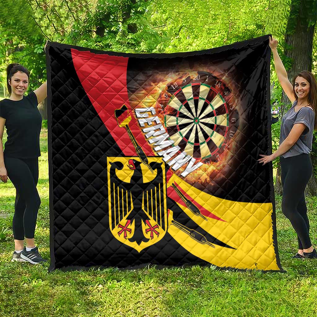 Quilt with black diamond stitching, Germany crest and dartboard artwork in red and yellow