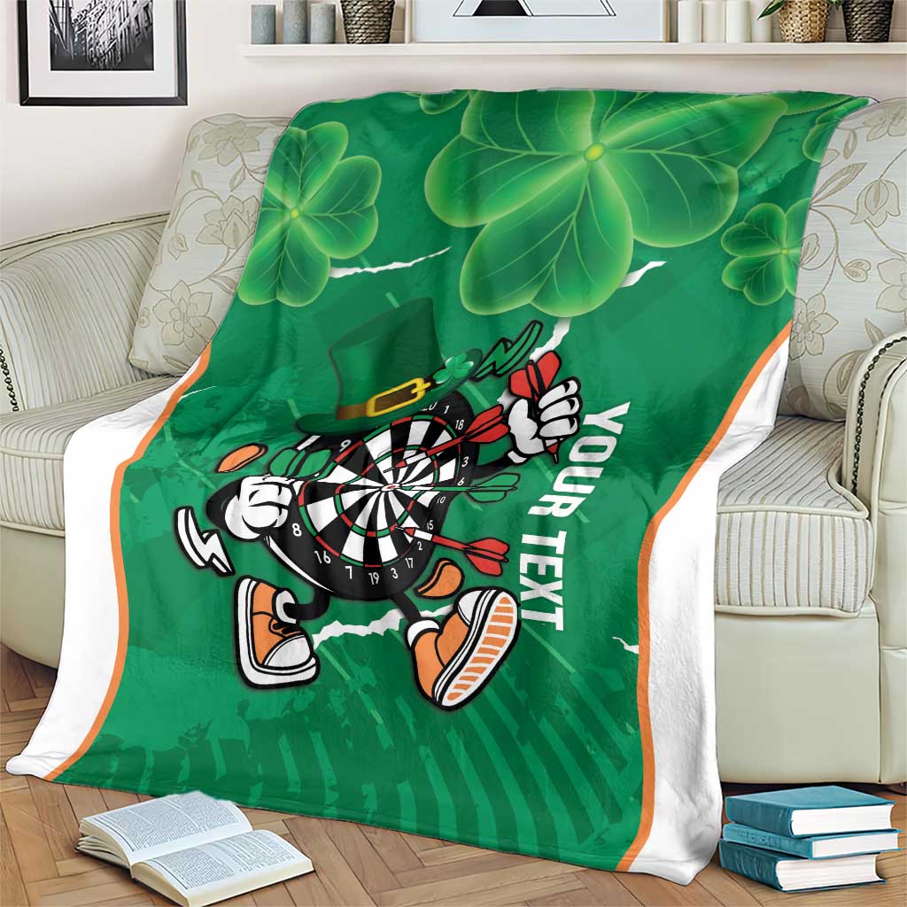 Green shamrock darts blanket featuring dartboard mascot and 'YOUR TEXT', orange stripes at edges