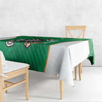 Green darts tablecloth draped over small dining table with shamrock border