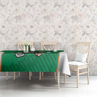 Green darts tablecloth featuring dartboard mascot and shamrock pattern strip
