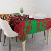 Darts tablecloth draped over table with bold green and red dragon graphic