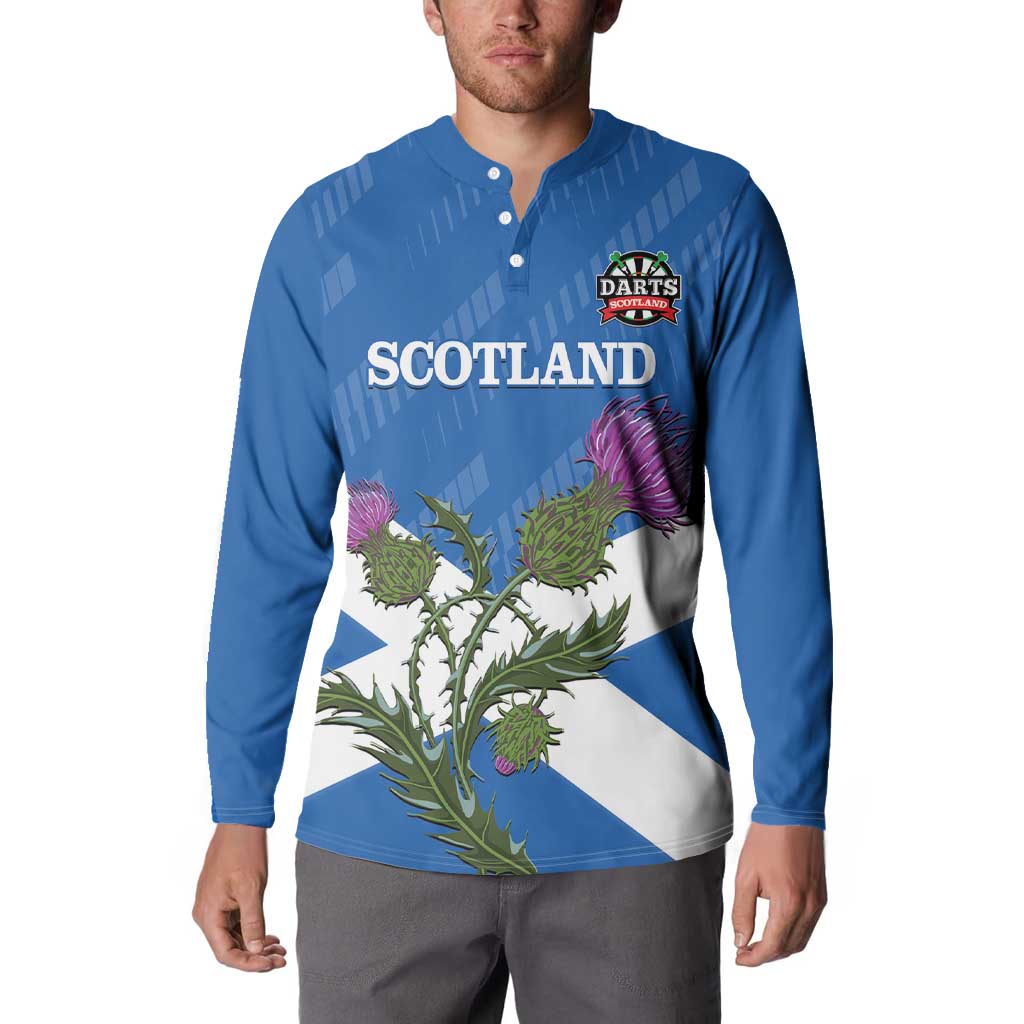 Blue button sweatshirt worn by model, Scotland text, darts logo, and thistle flag print