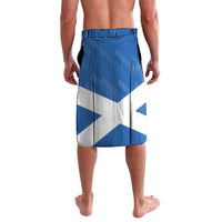 Blue flag-style darts lavalava shorts with white diagonal panels, elastic waistband