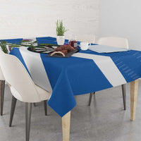 Blue and white darts tablecloth draped on table with diagonal stripes and dartboard