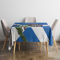 Blue and white Scotland darts tablecloth on table with dartboard, thistle leaves, and stripes
