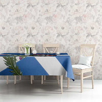 Blue and white Scotland darts tablecloth on dining table with dartboard and thistle design