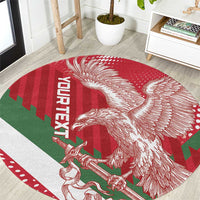 Red round football carpet with white eagle graphic and green stripe accents