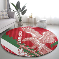 Red round football carpet with white eagle emblem and green-red geometric blocks