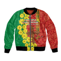 Red/green unisex bomber jacket with yellow flowers, central emblem, front zipper